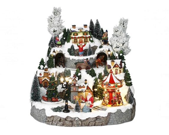 Villaggio natalizio innevato in movimento con giostre, carroo con cavallo e led